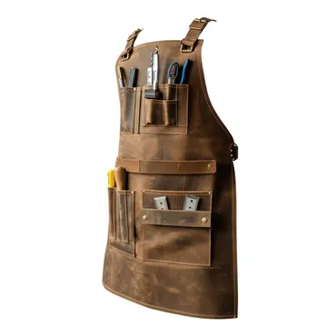 Close-up of the brown cowhide and brass rivets on a carpenter's leather apron